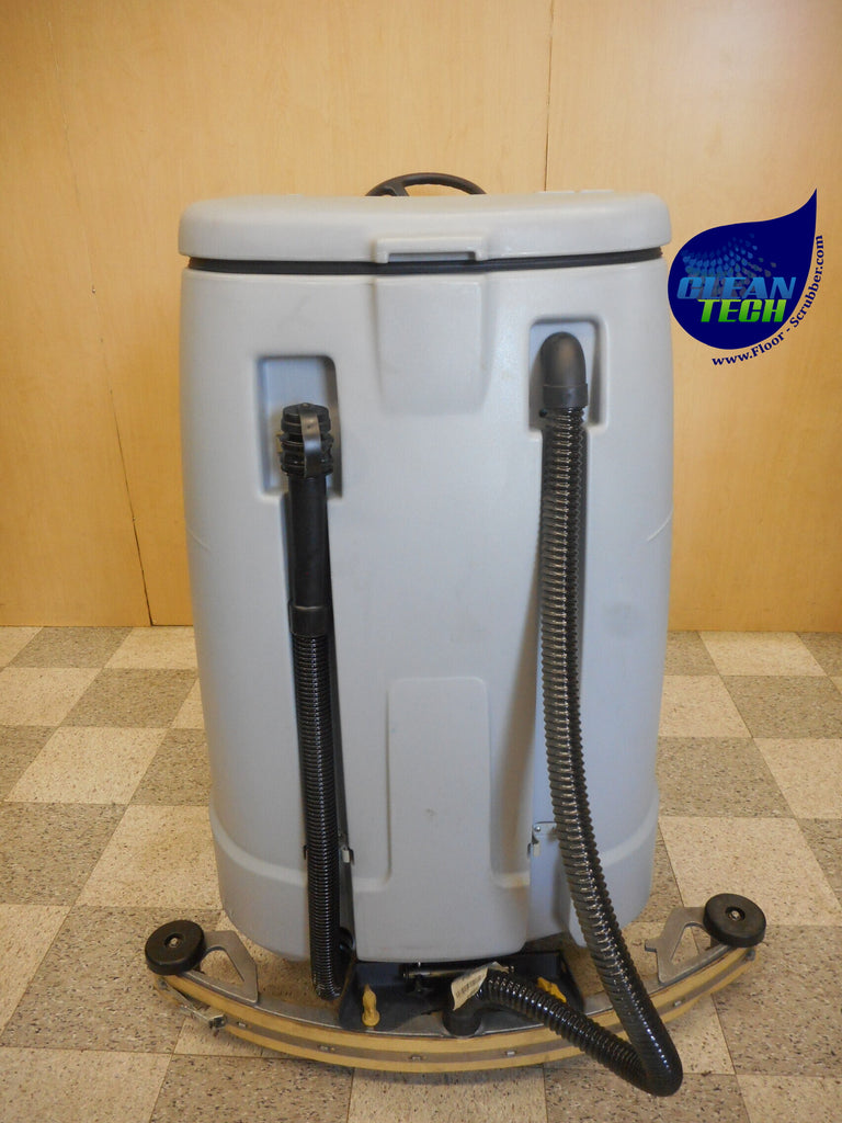 Close-up of the 28-inch dual disk scrub deck on a reconditioned Advance Advenger 2800 ST floor scrubber.