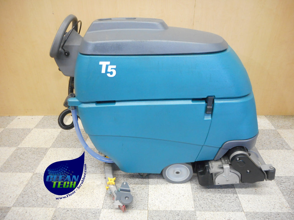 Tennant T5 floor scrubber cleaning tile flooring in a commercial building
